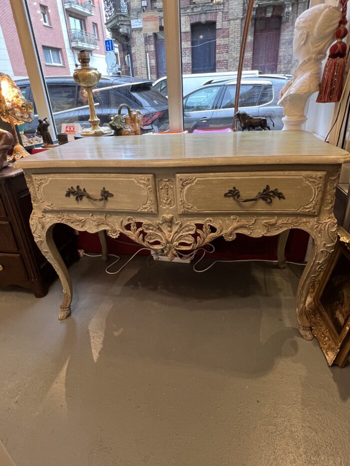 Console, table de chasse en bois rechampi sculpté, ouvrant par deux tiroirs en ceinture