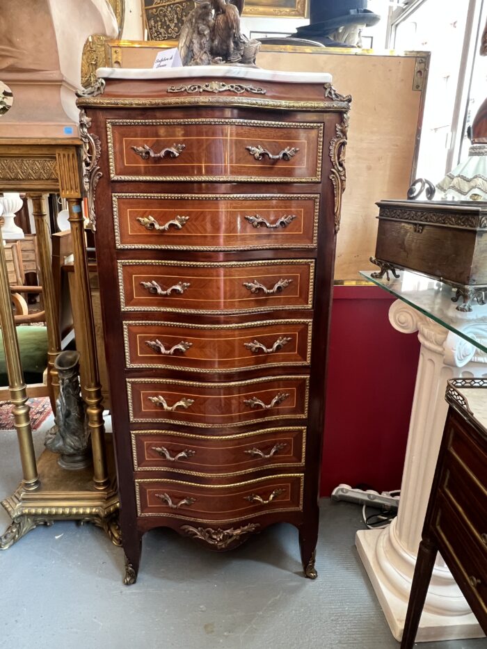 Semainier en bois de placage forme mouvementé et galbé, époque XXe siècle