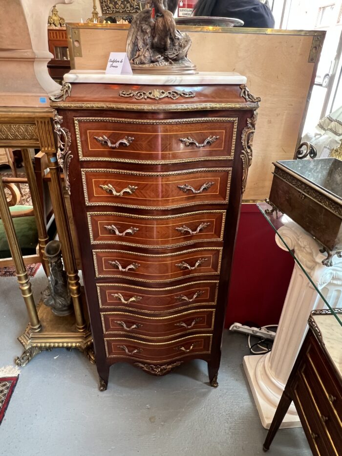 Semainier en bois de placage forme mouvementé et galbé, époque XXe siècle