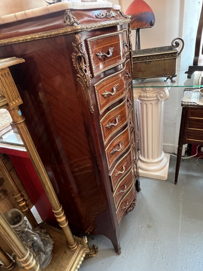 Semainier en bois de placage forme mouvementé et galbé, époque XXe siècle