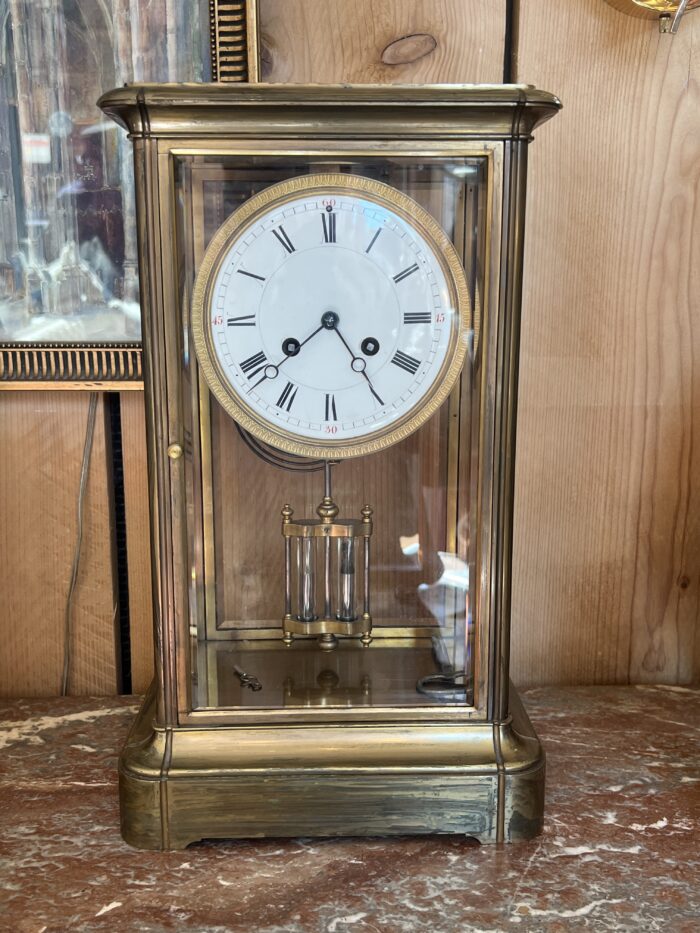 Pendule cage en laiton doré et massif, mouvement signé Marti, fin XIXe siècle