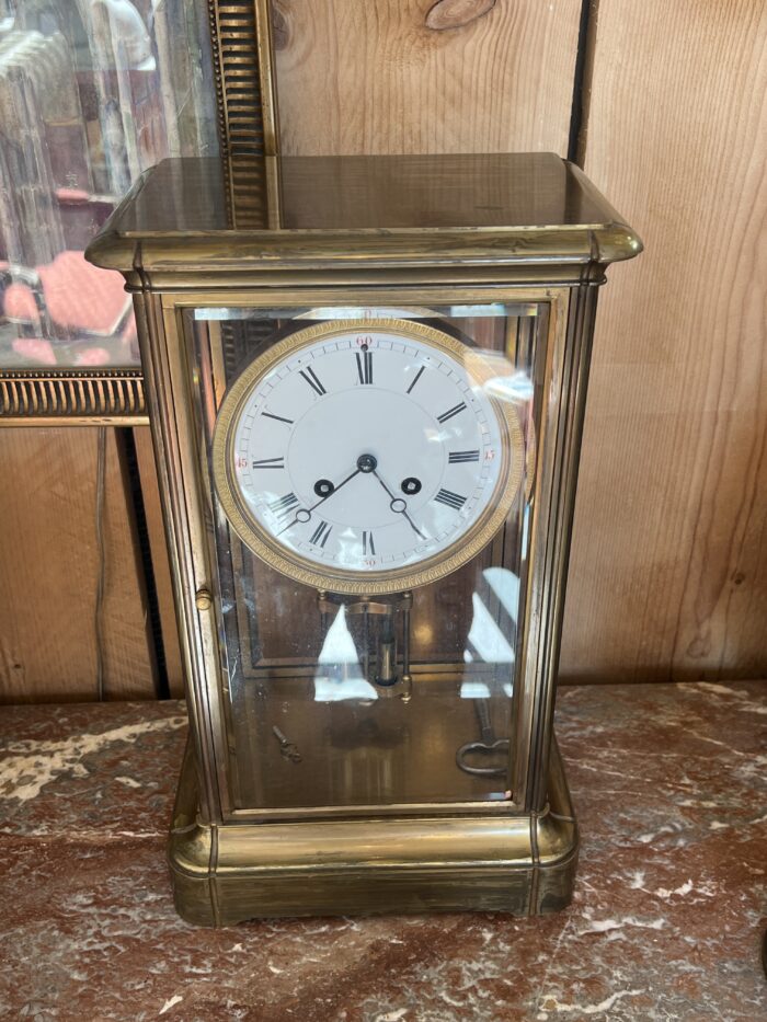 Pendule cage en laiton doré et massif, mouvement signé Marti, fin XIXe siècle