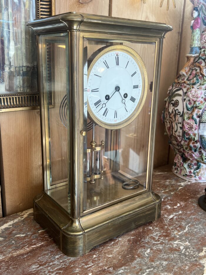 Pendule cage en laiton doré et massif, mouvement signé Marti, fin XIXe siècle