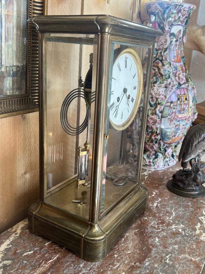 Pendule cage en laiton doré et massif, mouvement signé Marti, fin XIXe siècle